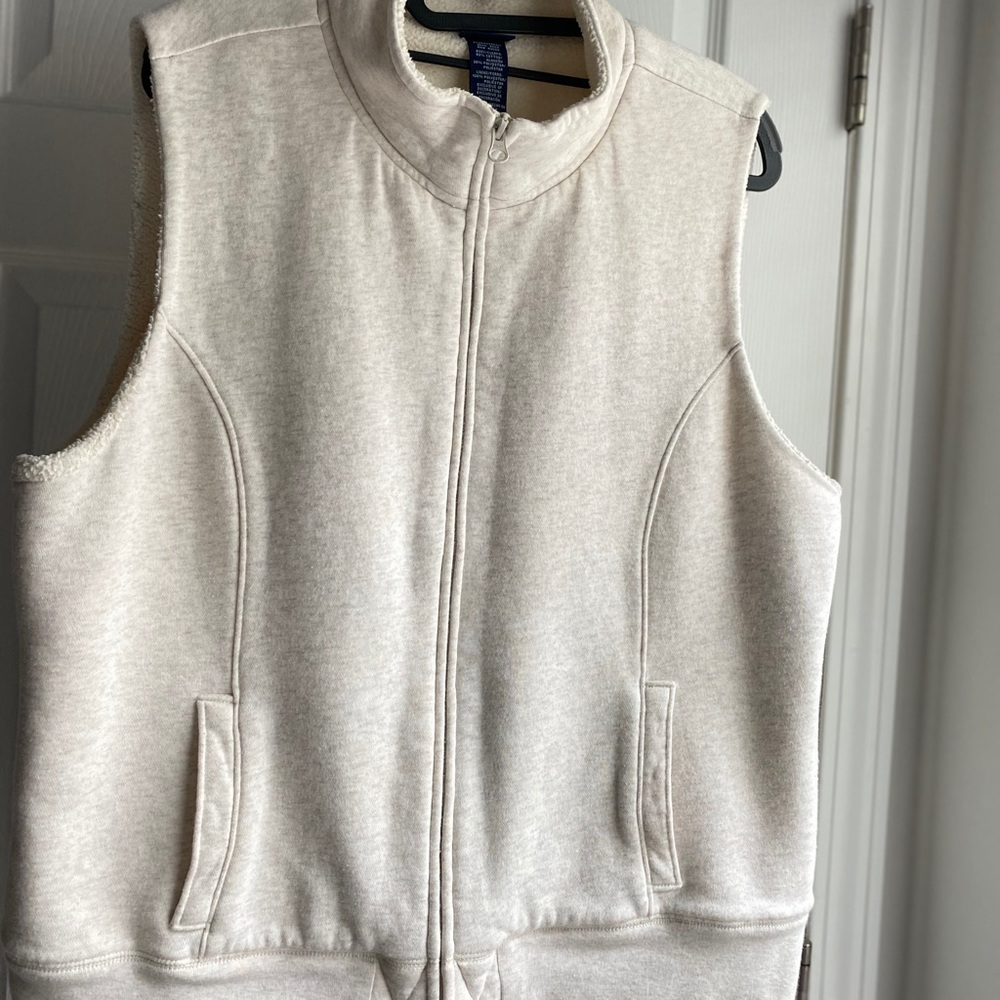 Warm, soft, stylish vest. Polyester fleece lined.